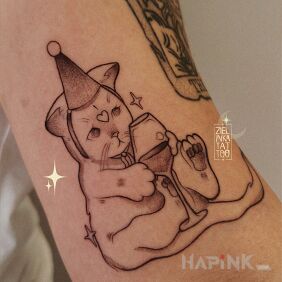 Tattoo Birthday Kitty On the arm motif: animals style: graphic / illustrative