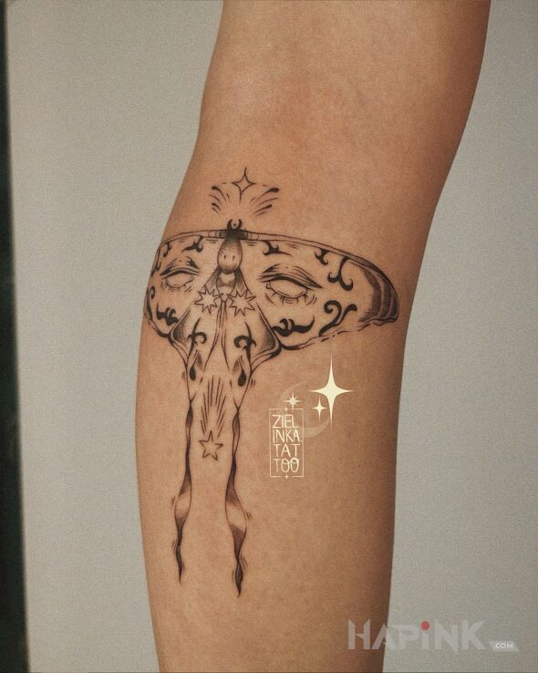 Tattoo Magical Moth in dark motif and surrealistic style on the calf