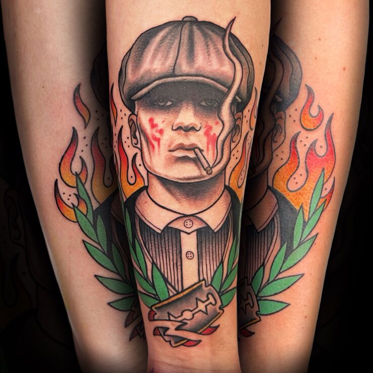 Tattoo Cinematic in faces motif and oldschool style On the arm