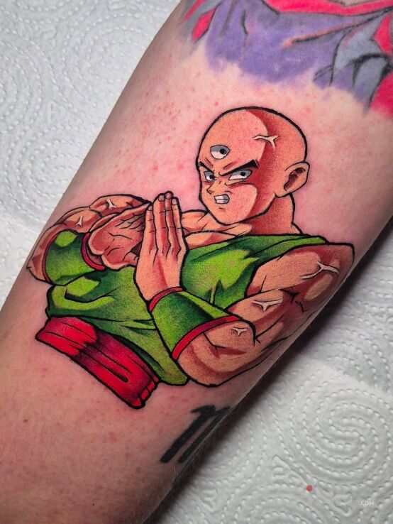 Tattoo Tenshinhan Dragon Ball in colorful motif and cartoon / comic book style On the arm
