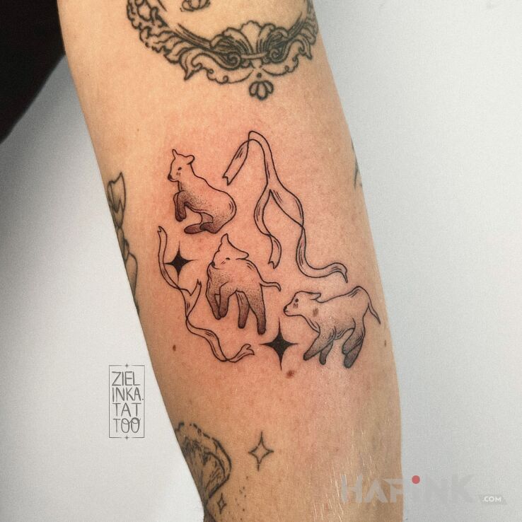 Tattoo Little Sheep in black and gray motif and graphic / illustrative style On the arm