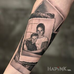Tattoo Mother and son photograph on the forearm motif: black and gray style: realistic