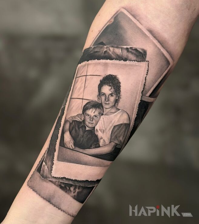 Tattoo Mother and son photograph in faces motif and realistic style on the forearm