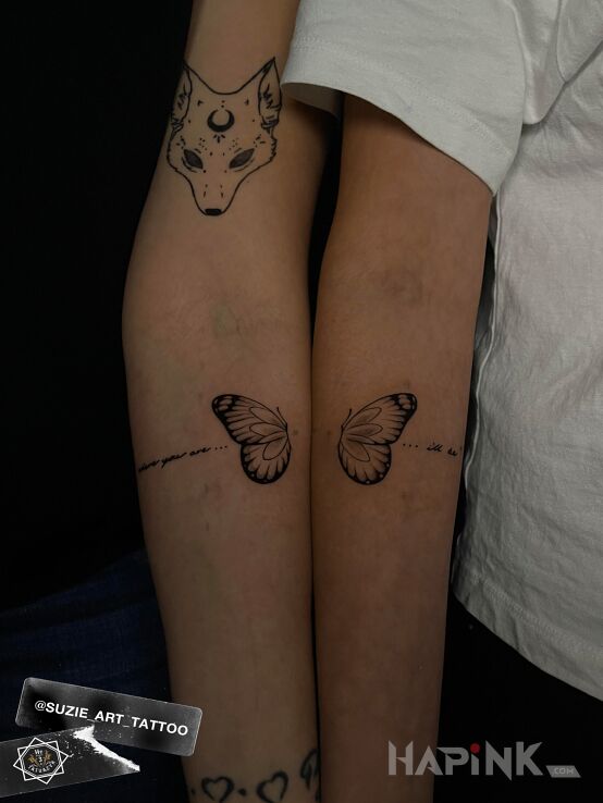Tattoo Matching butterfly in butterflies motif and minimalistic style on the forearm