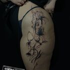 Black flowers on the side of the thigh