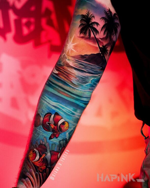 Tattoo Oceanic sleeve with fish and palm trees in nature motif and realistic style On the arm
