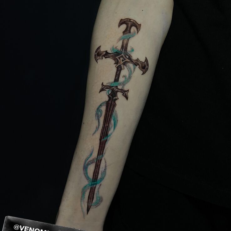 Tattoo Fantastic Sword in colorful motif and graphic / illustrative style On the arm