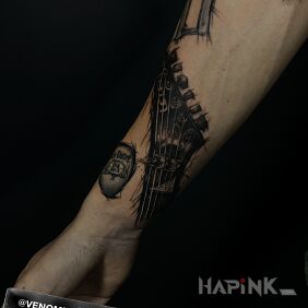Tattoo Guitar griffin in a dark style On the arm motif: black and gray style: graphic / illustrative
