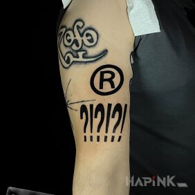 Tattoo Question marks on the upper arm motif: other style: blackwork / blackout