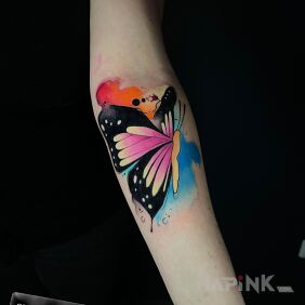 Tattoo Colorful butterfly with watercolor addition On the arm motif: colorful style: Watercolor