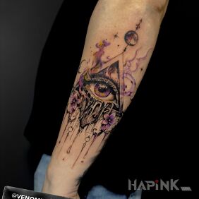 Tattoo Eye of Providence with floral additions on the forearm motif: colorful style: graphic / illustrative
