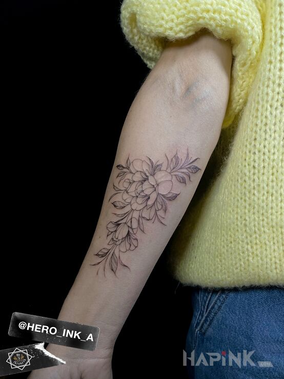 Tattoo Delicate fineline flowers in floral motif and graphic / illustrative style on the forearm