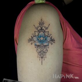 Tattoo Blue flower On the arm motif: flowers style: graphic / illustrative