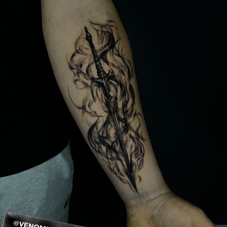 Tattoo Sword in the Clouds of Smoke in objects motif and graphic / illustrative style on the forearm