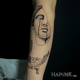 Tattoo Antique sculpture On the arm motif: black and gray style: graphic / illustrative
