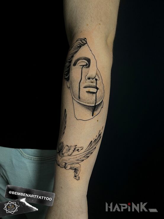 Tattoo Antique sculpture in faces motif and graphic / illustrative style On the arm