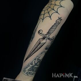 Tattoo Traditional Dagger On the arm motif: black and gray style: oldschool