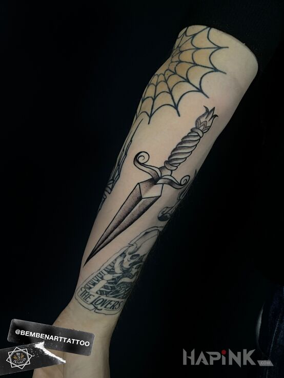 Tattoo Traditional Dagger in objects motif and oldschool style On the arm