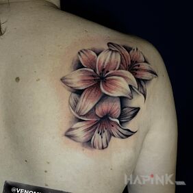 Tattoo Pink Lilies on the shoulder blades motif: colorful style: realistic