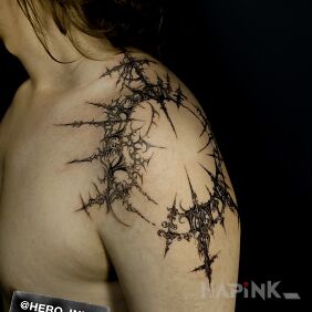 Tattoo Cyberigilism on the upper arm motif: ornaments style: graphic / illustrative