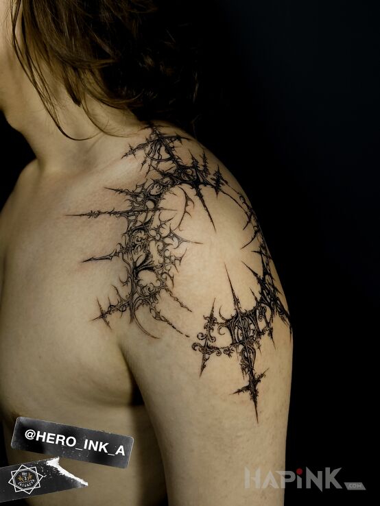 Tattoo Cyberigilism in ornaments motif and graphic / illustrative style on the upper arm