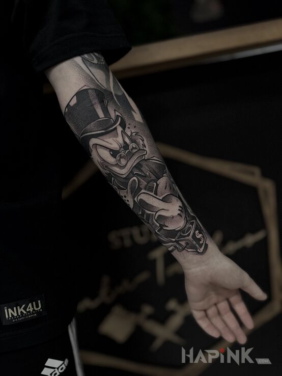 Tattoo Sknerus McKwacz in characters motif and graphic / illustrative style On the arm