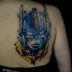 Tattoo Transformers on the shoulder blades motif: science fiction style: graphic / illustrative