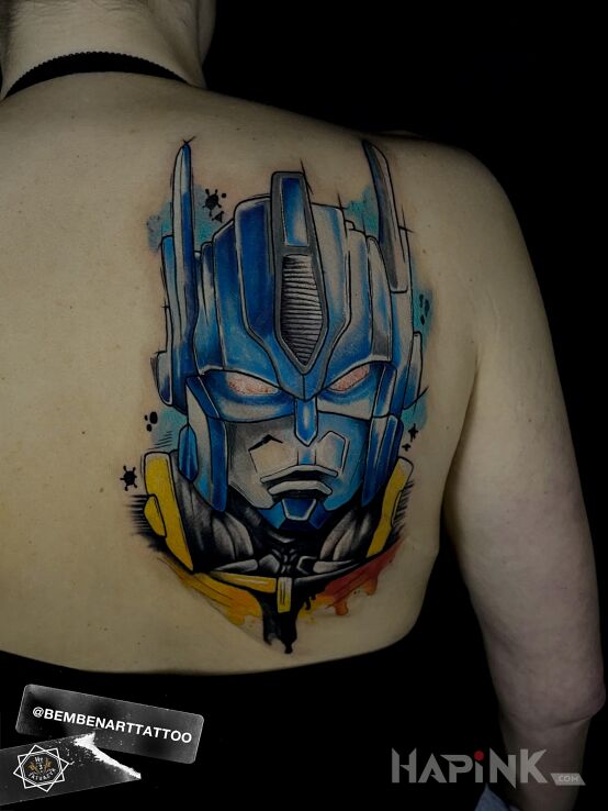 Tattoo Transformers in colorful motif and graphic / illustrative style on the shoulder blades