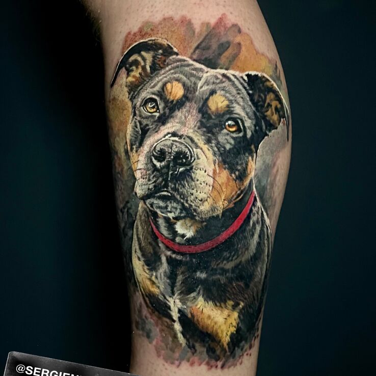 Tattoo Color portrait of a dog in animals motif and realistic style on the leg