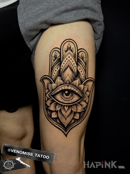 Tattoo Hamsa in mandalas motif and graphic / illustrative style on the leg