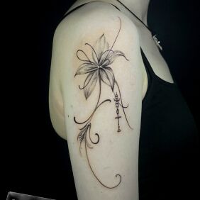 Tattoo Lilia on the upper arm motif: floral style: graphic / illustrative