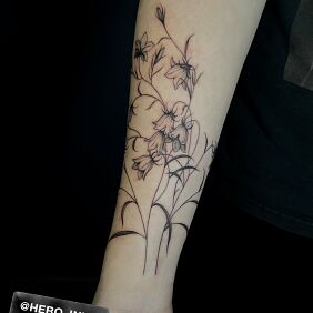 Tattoo Bells on the forearm motif: floral style: graphic / illustrative