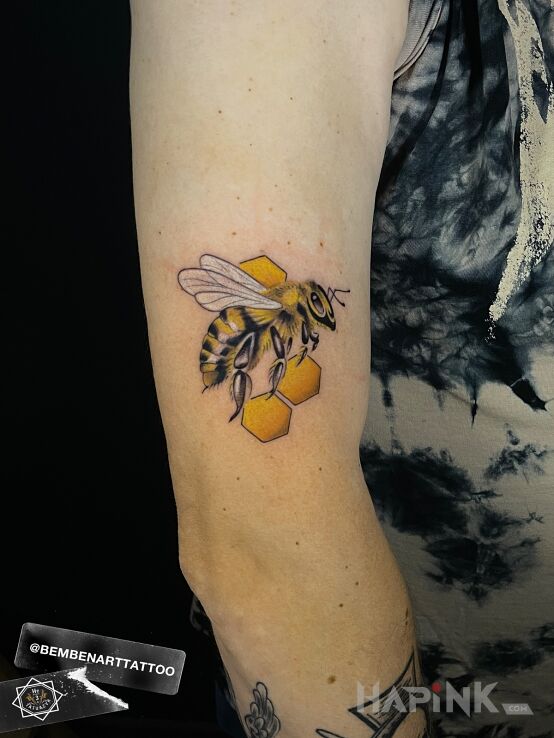 Tattoo Bee in realistic style On the arm