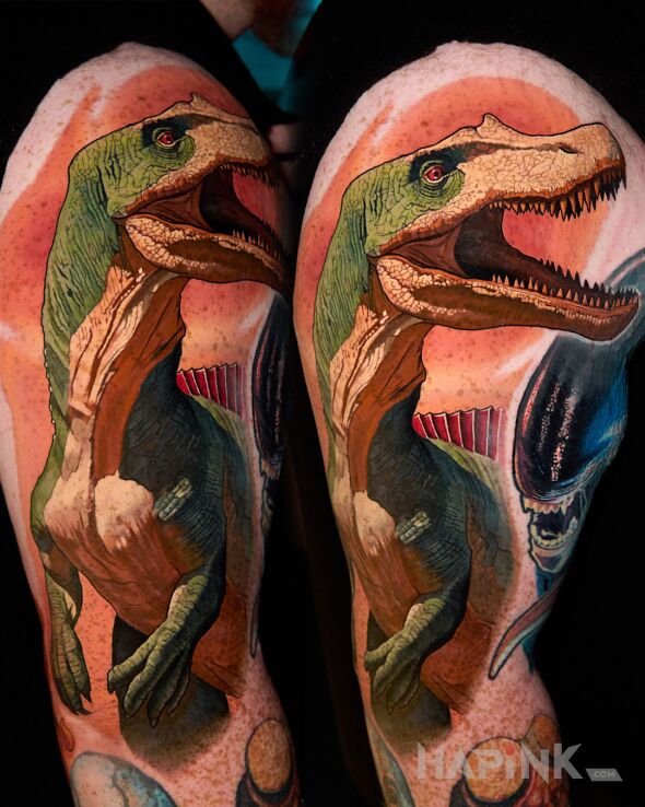 Tattoo Dino in colorful motif and realistic style on the upper arm