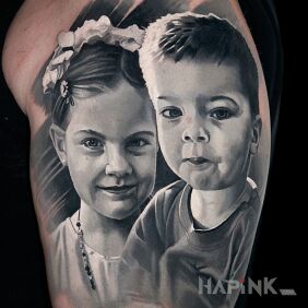 Tattoo Portrait of Children on the upper arm motif: cover-up style: realistic