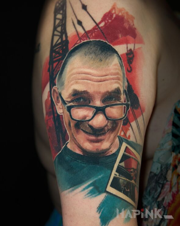 Tattoo Father's portrait in colorful motif and realistic style on the upper arm