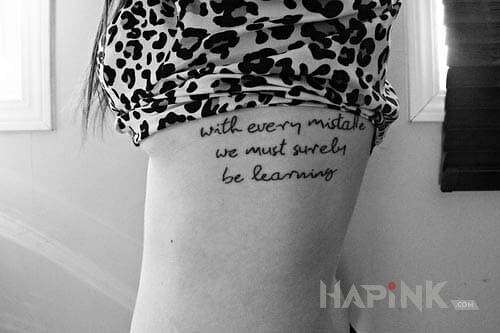 Tattoo Napis in lettering motif on the ribs
