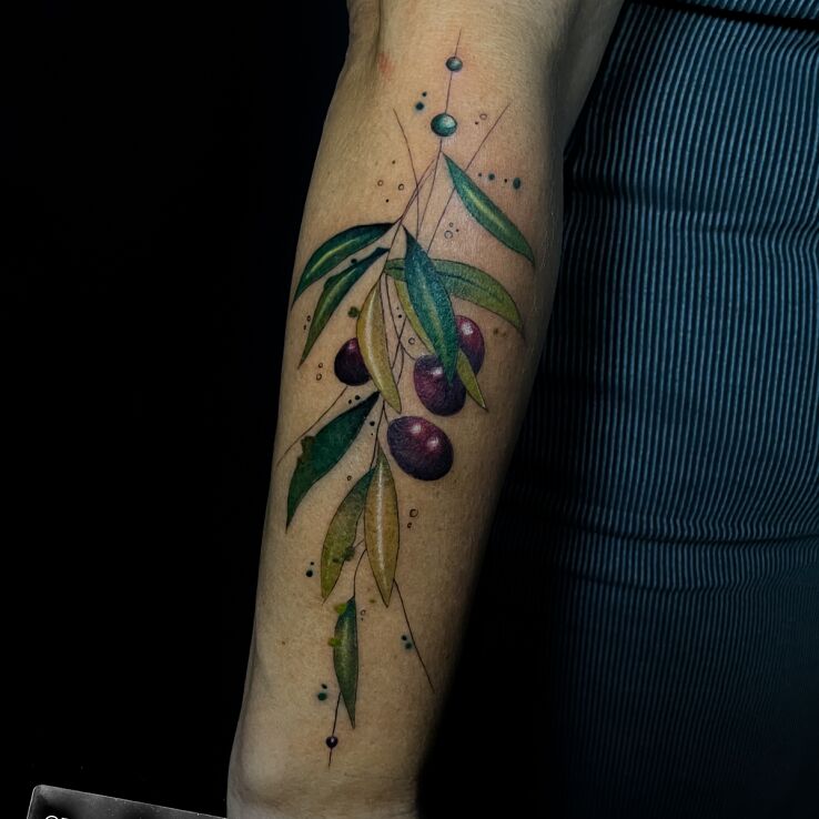 Tattoo Gałązka oliwna in flowers motif and graphic / illustrative style on the forearm