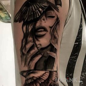 Tattoo Bird mind on the upper arm motif: faces style: realistic