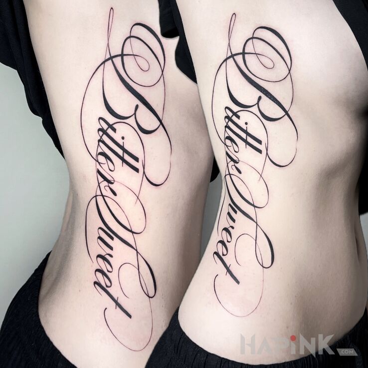 Tattoo Thin, elegant calligraphic inscription Bitter Sweet in black and gray motif and calligraphy style on the ribs