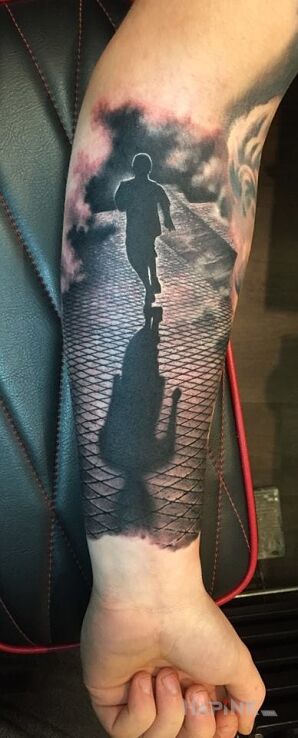Tattoo Cień in characters motif on the forearm