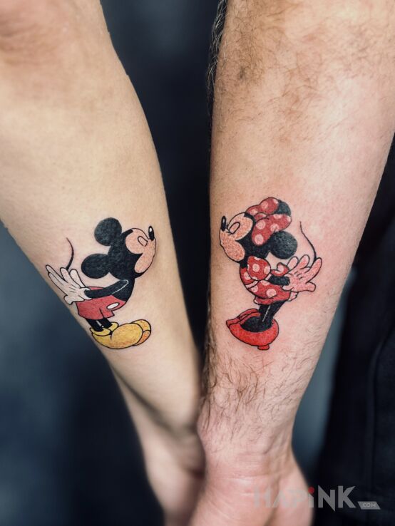 Tattoo Mickey and Minnie in characters motif and graphic / illustrative style on the forearm