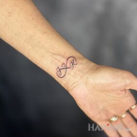 Tattoo Infinity with Letters On the arm motif: other style: contour / linework