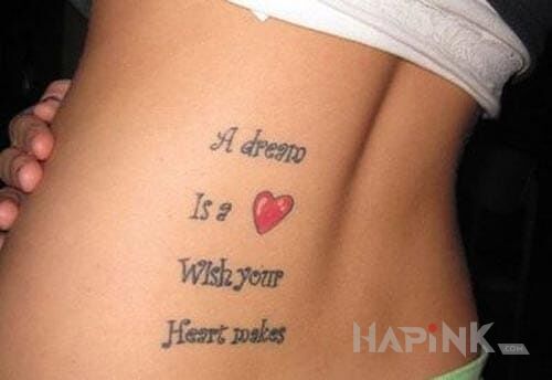 Tattoo Cos o sercu in lettering motif on the back