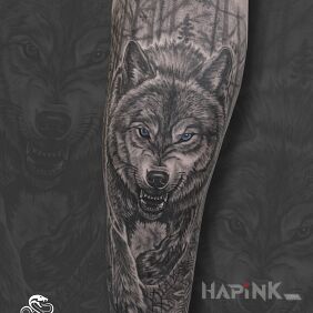 Tattoo Realistic Wolf with Blue Eyes on the forearm motif: nature style: realistic