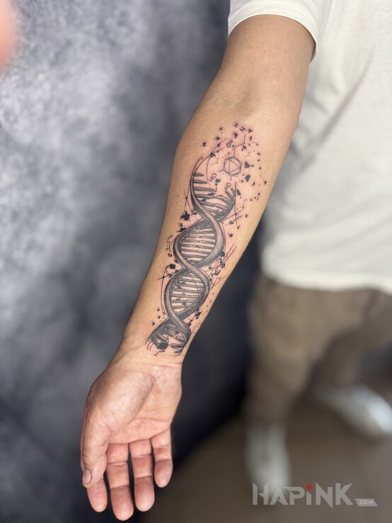 Tattoo D N A in black and gray motif and graphic / illustrative style On the arm