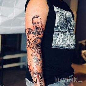 Tattoo Such my..... on the upper arm motif: faces