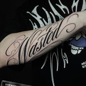 Tattoo Wasted On the arm motif: black and gray style: calligraphy