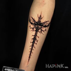 Tattoo Neotribal on the forearm motif: dark style: blackwork / blackout