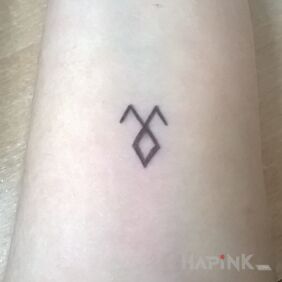 Tattoo Demon sign on the forearm motif: demons